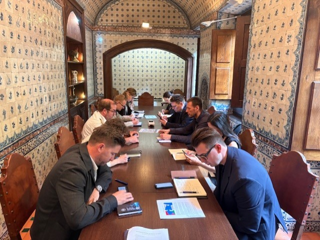 A group of people at a conference table